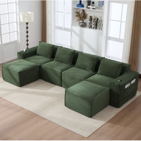 Sofá modular de 4 plazas en terciopelo acanalado verde con 2 pufs, portavasos y bolsillos (1/5)