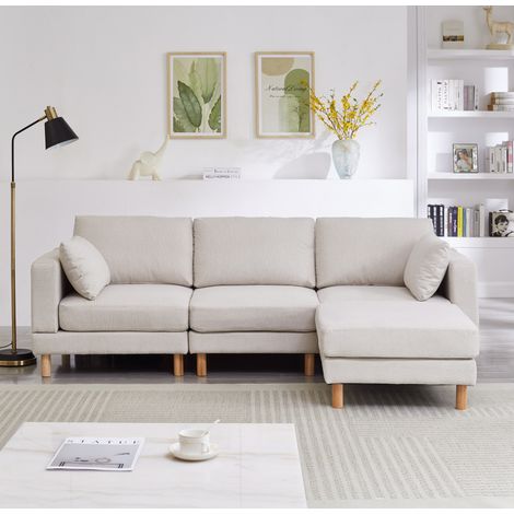 Canapé de esquina 3 plazas de tejido poliéster beige con otomana reversible y patas de madera