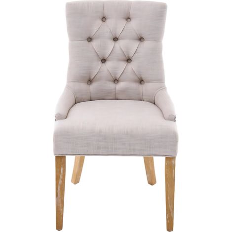 Set de 2 sillas de comedor tapizadas en tejido beige con patas de madera y tachuelas (1/5)