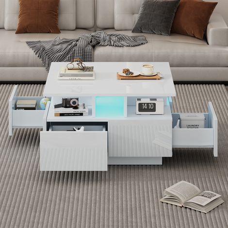 Table basse blanche 70x70x40 cm haute brillance,avec LED et 4 tiroirs. Géométrique et stable,charge 30 kg.