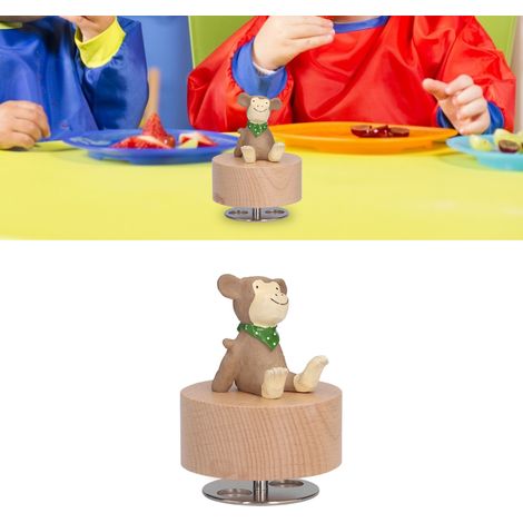Une boîte à musique ronde avec un socle en forme de singe, idéale à offrir pendant les fêtes. (1/5)