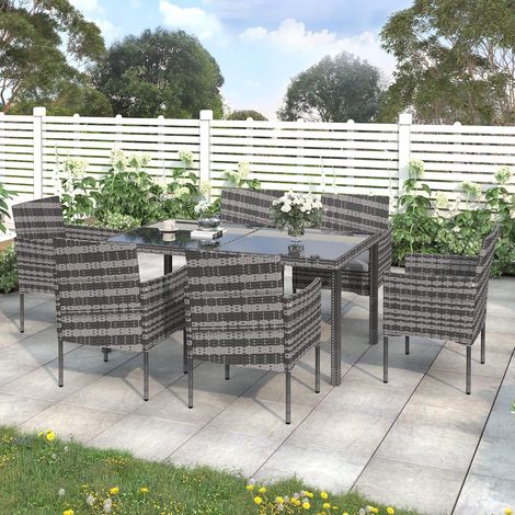 Conjunto de muebles de jardín de ratán con mesa rectangular y sillas de cristal resistente a la intemperie, color gris, ideal para terrazas y patios. (1/5)