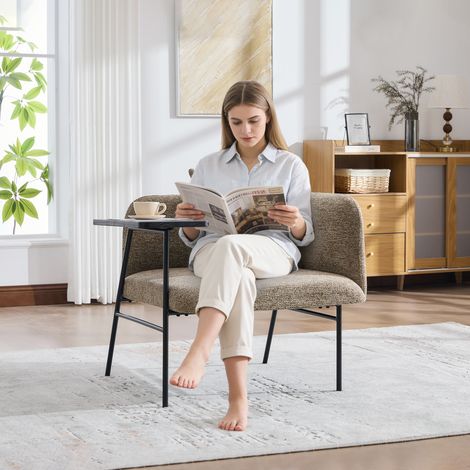 Fauteuil design confortable en tissu, avec dossier rembourré et deux casiers de rangement, livré avec une table d’appoint élégante. Cette table minimaliste en métal solide offre un espace de rangement