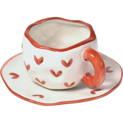 Este juego de taza y platillo de cerámica presenta un creativo diseño de corazón rojo y tiene una capacidad de 300 ml. (1/4)