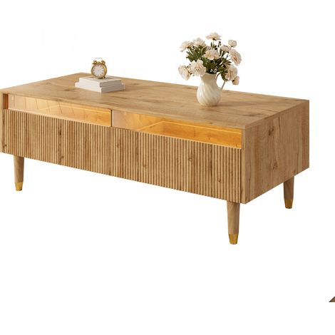 Cette table basse LED moderne dispose d’une façade de tiroir ondulée, de pieds couleur bois et or, de deux tiroirs et d’un bandeau LED à couleurs changeantes (1/5)