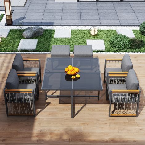 Conjunto de sofá de jardín de 6 plazas: 4 sillones, 2 taburetes y 1 mesa. Tablero de cristal, madera, metal y ratán sintético, natural y negro. (1/5)