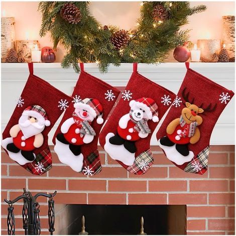 Four Christmas stockings to hang, a family fireplace decoration for the holidays. (1/5)