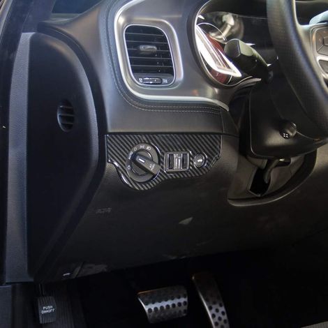 Carbon fiber interior trim for Dodge Challenger headlight switch panel. (1/4)