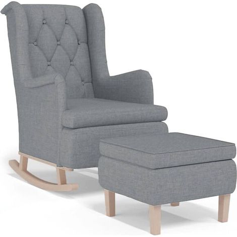 Un fauteuil à bascule avec repose-pieds, recouvert de tissu gris clair. (1/5)
