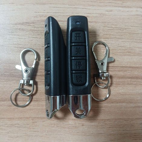 Mando a distancia clonable de 433 MHz para puertas de garaje, persianas enrollables y puertas correderas - Paquete de 2 con batería y llavero.
