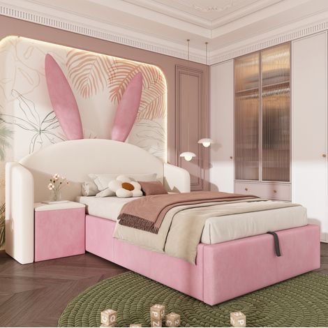 Cama infantil 90x200 cm beige y rosa de terciopelo con almacenaje hidráulico y mesita (1/5)