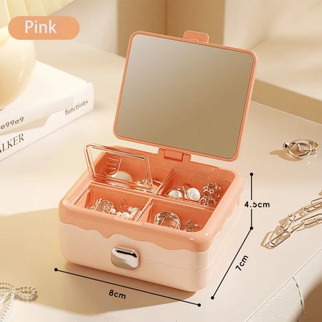 Une boîte à bijoux rose avec miroir pour ranger boucles d'oreilles, bagues et colliers. (1/5)