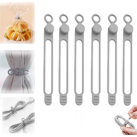 Confezione da 6 fascette elastiche in silicone riutilizzabili per organizzare e fissare cavi come quelli di auricolari e caricabatterie per cellulari (grigio). (1/5)