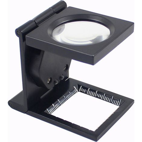 Lente d'ingrandimento pieghevole con contapassi e montatura in metallo verniciato nero. (1/4)