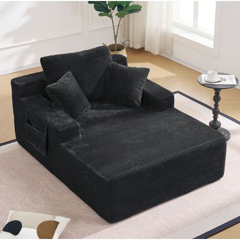 Sofá cama de pana negra con bolsillos laterales y cojines, sin montaje (1/5)