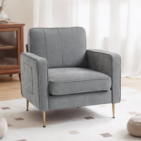 Fauteuil confortable en tissu gris avec pieds dorés et poches latérales, pour salon, bureau ou chambre (1/5)