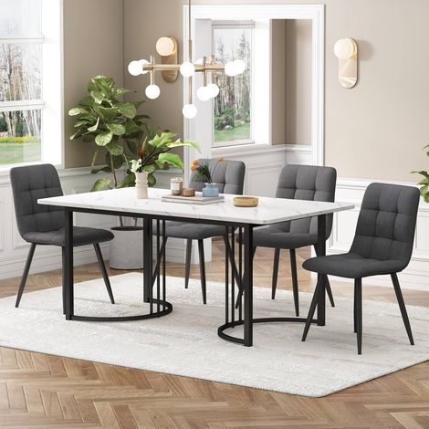Ensemble repas 140x80cm avec table blanche et 4 chaises en tissu gris foncé, pieds métal noirs (1/5)
