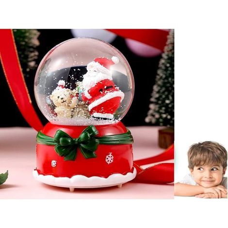 A glowing musical Christmas ball with colorful lights and Santa, perfect for desk decor or as a gift.