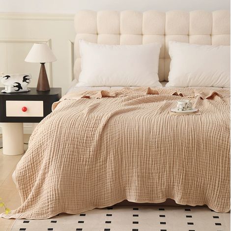 Cette couverture kaki en pur coton, lavable et respirante, est idéale pour une utilisation sur les canapés, les lits, les fauteuils inclinables ou pour se détendre à la maison. (1/4)