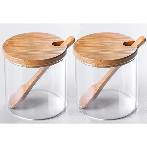 Un ensemble de deux pots à épices en verre transparent, des récipients de rangement décoratifs simples et élégants.