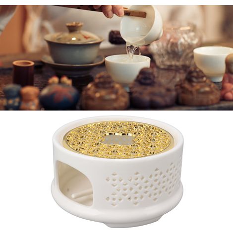 Teewärmer im japanischen Stil mit durchbrochenem Design, weißem Sockel und Kerzenhalter. (1/5)