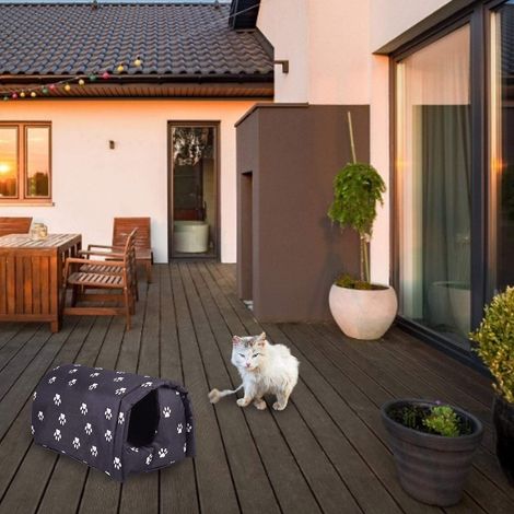 Niche douillet et chauffant pour chat avec motif empreintes de pattes, idéal pour un repos confortable et sécurisé (1/5)