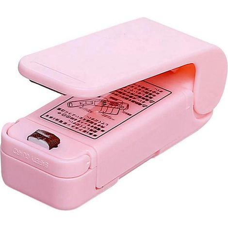 Mini scelleuse portable rose pour sacs plastiques ménagers et snacks. Machine de thermoscellage piézoélectrique manuelle. (1/5)