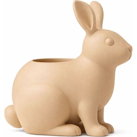 Un pot de fleurs moderne et décoratif en forme de lapin, de couleur beige. (1/3)