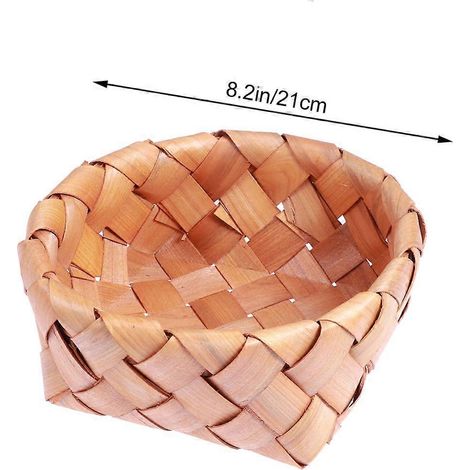 Un grand panier rond en bois tressé à la main, pour la cuisine. (1/5)