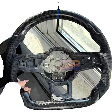 Volante in fibra di carbonio, design leggero, con fori (1/2)