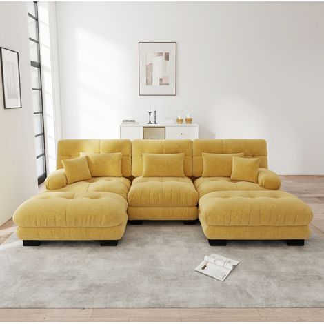 Divano modulare ad angolo 313/145/81 cm in ciniglia gialla con pouf mobili, seduta profonda e comfort avvolgente (1/5)