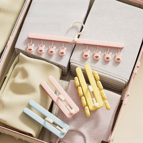 Joli étendoir à vêtements pliable, portable pour les voyages, multifonctionnel pour chaussettes et vêtements (une des trois couleurs chacune) (1/5)