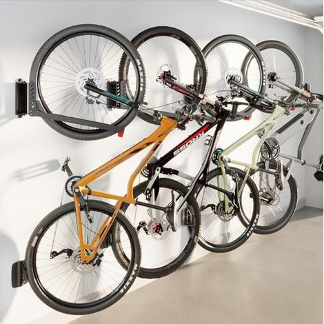 Support Mural Vélo Pivotant, Charge 35 kg Accrochez et décrochez votre vélo facilement tout en libérant de l'espace dans le garage, la cave ou le local de rangement. (1/5)