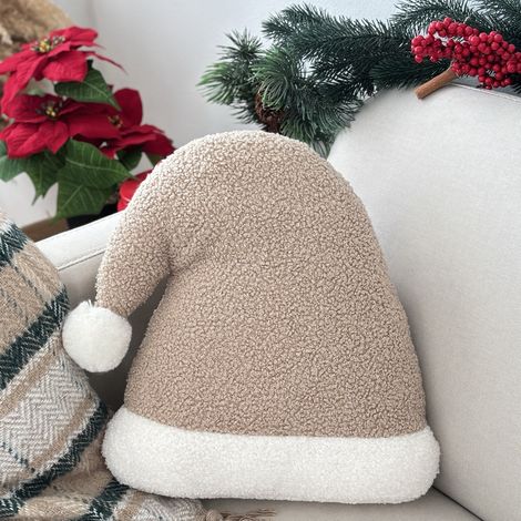Weihnachtskissen in Form eines Weihnachtsmannnestes. Beigefarbenes Bouclé-Kissen mit Weihnachtsmannmotiv. (1/5)