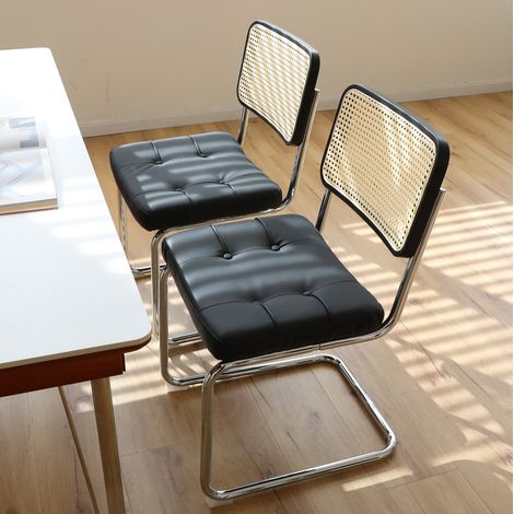 Set de 2 sillas de comedor de polipiel negra, base cromada, estilo moderno (1/5)