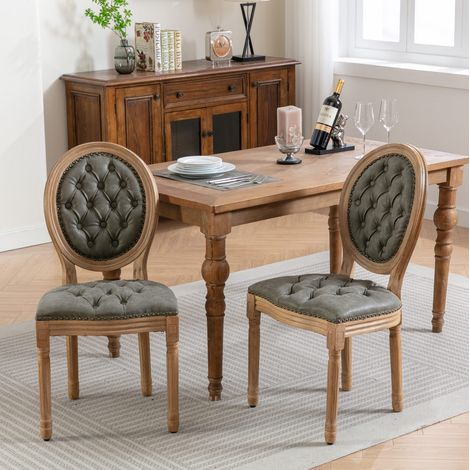 Juego de 2 sillas de comedor de estilo campestre francés, de piel sintética color verde oliva, con respaldo ovalado capitoné. (1/5)