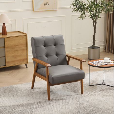 Sillón de salón de piel gris con reposabrazos de madera y patas de madera, con costuras decorativas (1/5)