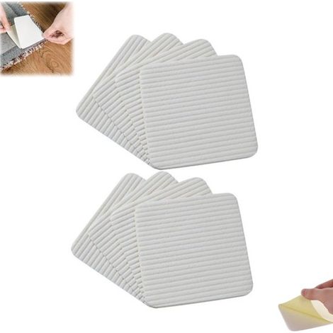 Confezione da 8 adesivi quadrati antiscivolo per tappeti e moquette, senza residui. (1/5)