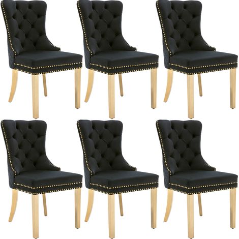 Chaise de salle à manger en velours noire avec poignées rondes et pieds en acier inoxydable doré (1/5)