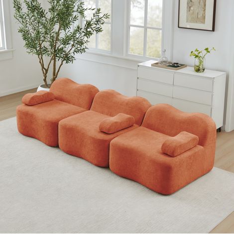 Canapé modulaire 3 places en velours orange, sans structure interne, assise profonde et modules configurables (1/5)