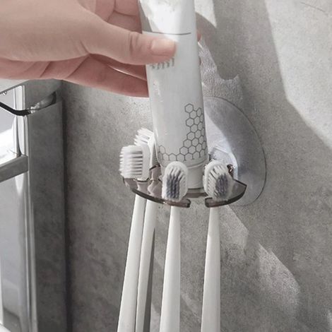 Porte-brosses à dents mural avec ventouses et rangement pour dentifrice, adapté à la salle de bain. (1/4)