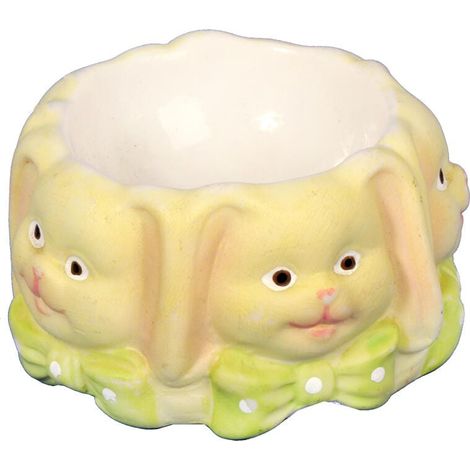 Soporte de cerámica para huevos con forma de conejito, color amarillo. (1/3)
