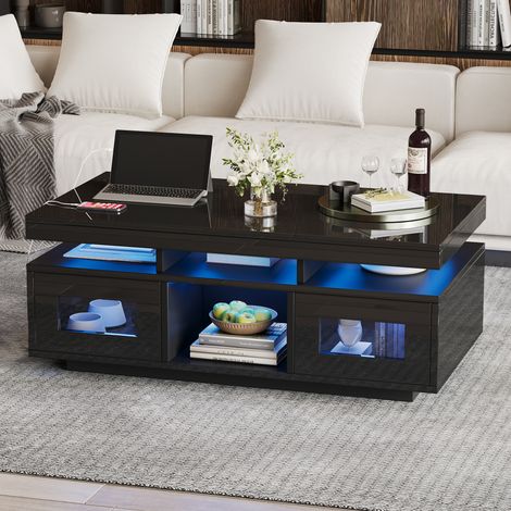 Table de salon LED 100x50x43 cm noire laquée brillante, avec éclairage commandé par application, meuble bas avec armoire et prise électrique + chargeur, idéale pour canapé, bureau ou salle d'étude.