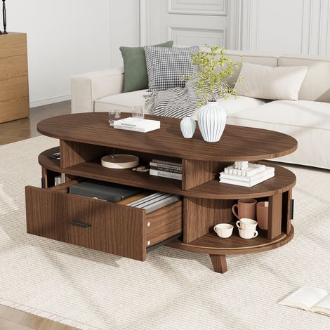 Table Basse Ovale 100x50x40 cm avec 1 Tiroir, 2 Portes à Rideau, 3 Niches Ouvertes et 4 Pieds en Bois, MDF et Panneaux de Particules - Noyer (1/5)
