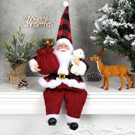 Handgefertigte sitzende Weihnachtsmannfigur mit Geschenktüte und kleinem