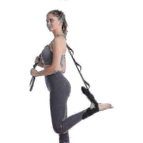 Les bandes élastiques noires de résistance sont utilisées pour les exercices de souplesse en yoga et pour l'étirement des fascias et des ligaments des jambes. (1/5)