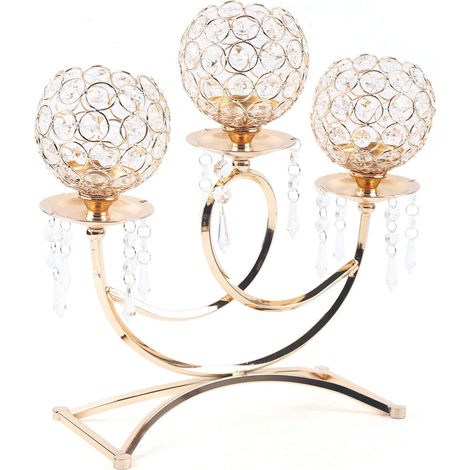 Candelabro de tres brazos en cristal dorado, pieza central para el comedor.