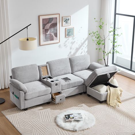 Ce grand canapé en velours côtelé est doté d'un revêtement en mousse confortable. Il comprend un accoudoir central amovible (avec deux porte-gobelets et un espace de rangement), un port USB-C, (1/5)
