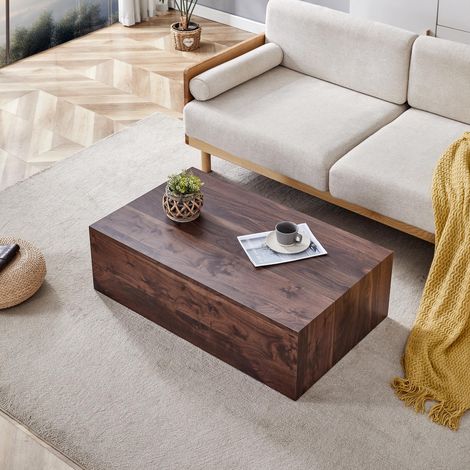 Table basse rectangulaire en MDF, finition noyer. Dimensions : 90 × 50 × 30 cm. Livrée montée. Pieds antidérapants. Idéale pour un intérieur moderne et raffiné.