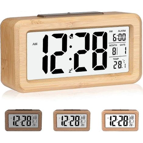 Ce réveil numérique en bois est doté de grands chiffres faciles à lire et d'un volume réglable pour vous assurer un réveil à l'heure. Idéal pour la chambre, il comprend également un port USB pour plus (1/5)